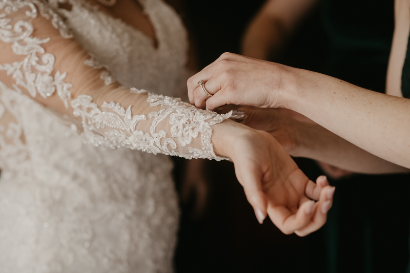 A bride getting ready at the Double Tree Hilton Hotel Baltimore for a Mt. Washington Mill Dye House in Baltimore, Maryland by Britney Clause Photography