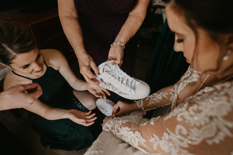 A bride getting ready at the Double Tree Hilton Hotel Baltimore for a Mt. Washington Mill Dye House in Baltimore, Maryland by Britney Clause Photography