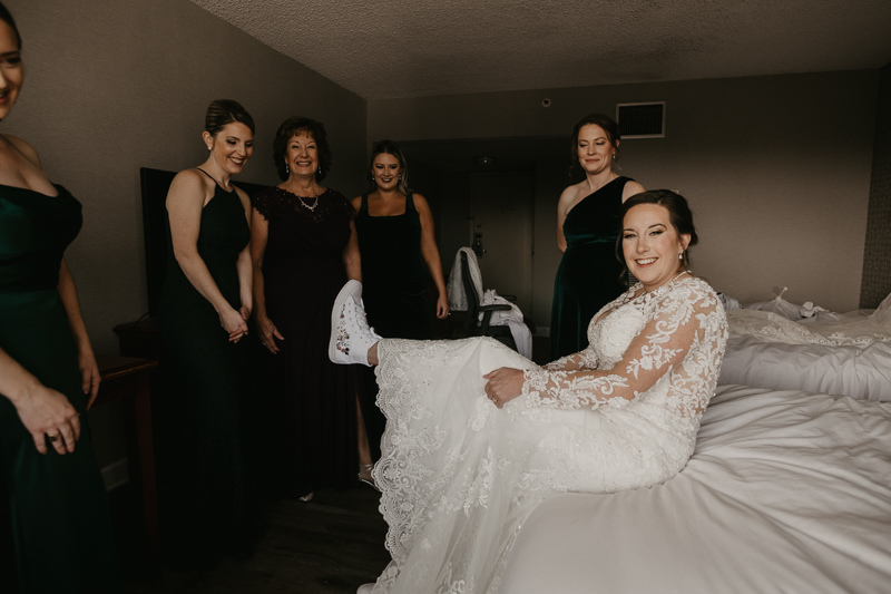 A bride getting ready at the Double Tree Hilton Hotel Baltimore for a Mt. Washington Mill Dye House in Baltimore, Maryland by Britney Clause Photography