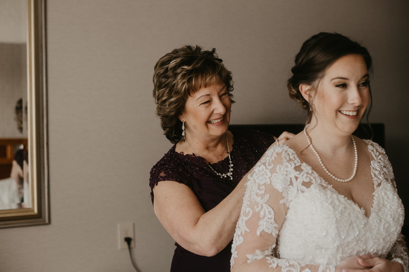 A bride getting ready at the Double Tree Hilton Hotel Baltimore for a Mt. Washington Mill Dye House in Baltimore, Maryland by Britney Clause Photography