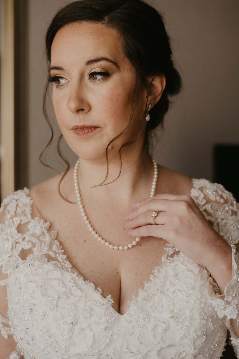 A bride getting ready at the Double Tree Hilton Hotel Baltimore for a Mt. Washington Mill Dye House in Baltimore, Maryland by Britney Clause Photography