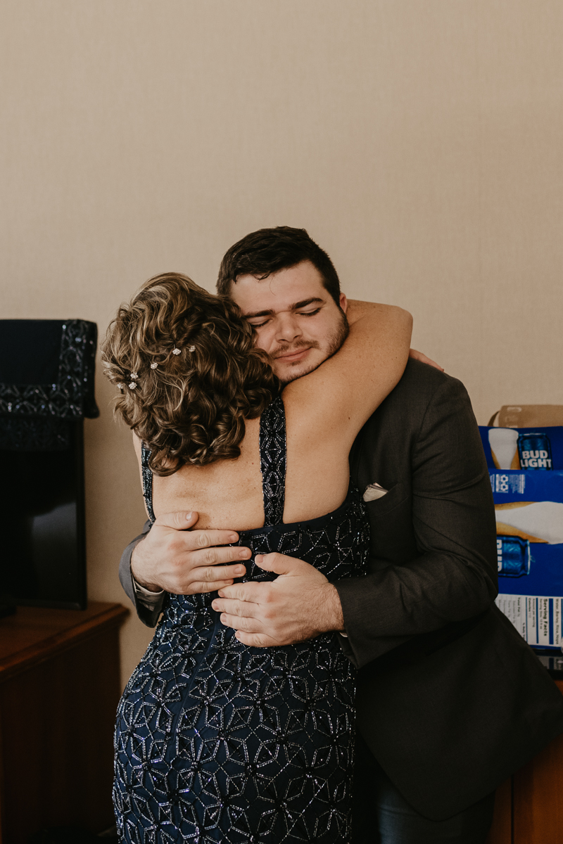 A groom getting ready at the Double Tree Hilton Hotel Baltimore for a Mt. Washington Mill Dye House in Baltimore, Maryland by Britney Clause Photography