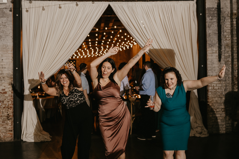 An evening wedding reception at the Mt. Washington Mill Dye House in Baltimore, Maryland by Britney Clause Photography