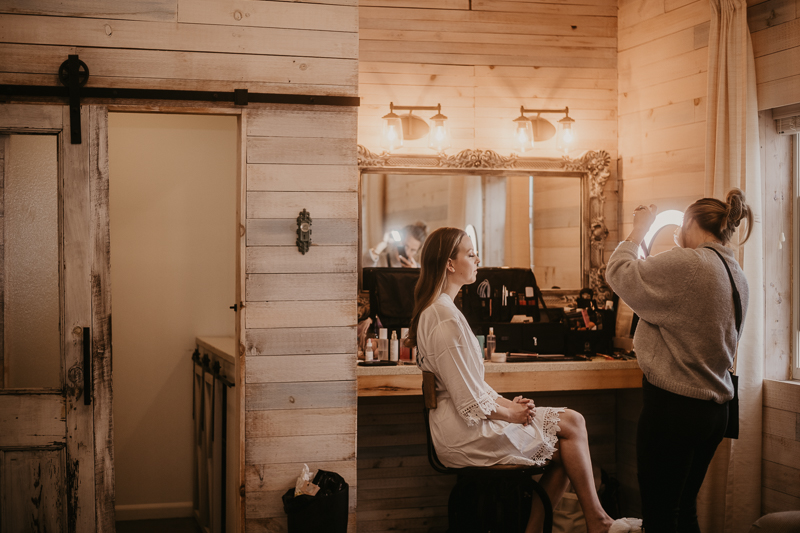 A bride getting ready for her wedding at Kylan Barn in Delmar, Maryland by Britney Clause Photography