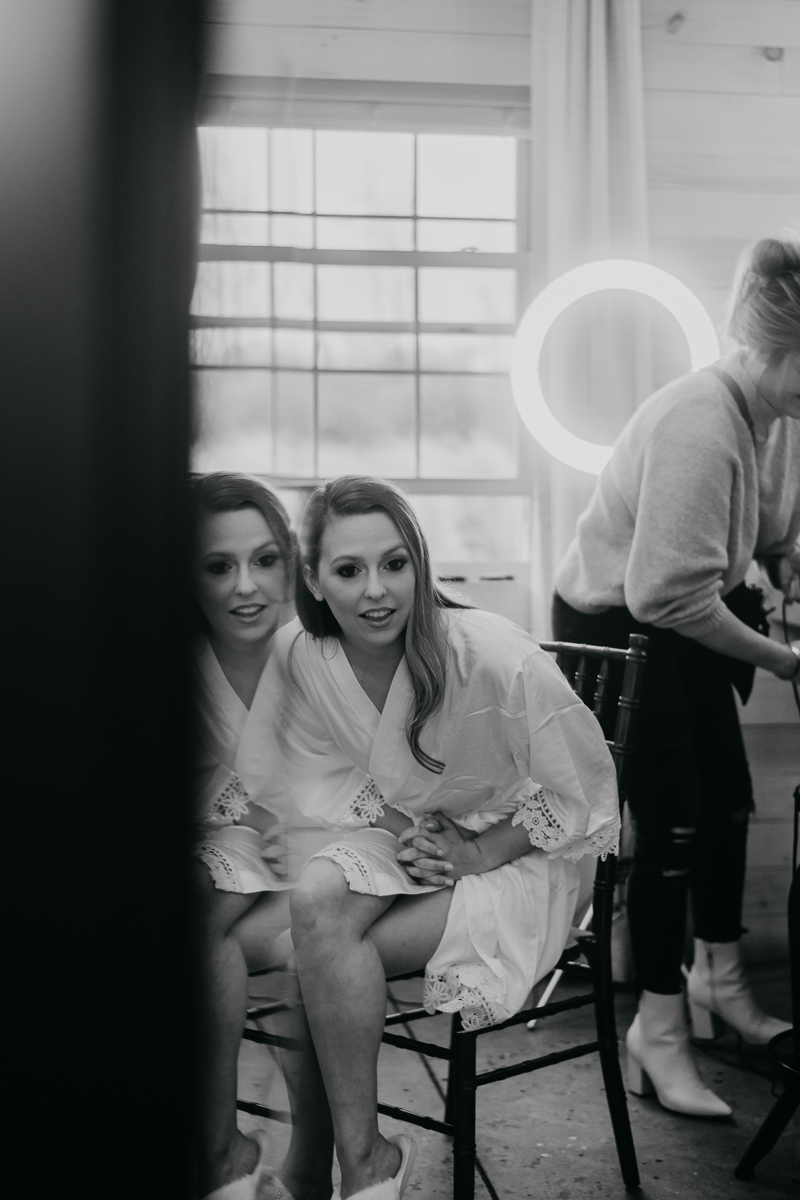 A bride getting ready for her wedding at Kylan Barn in Delmar, Maryland by Britney Clause Photography