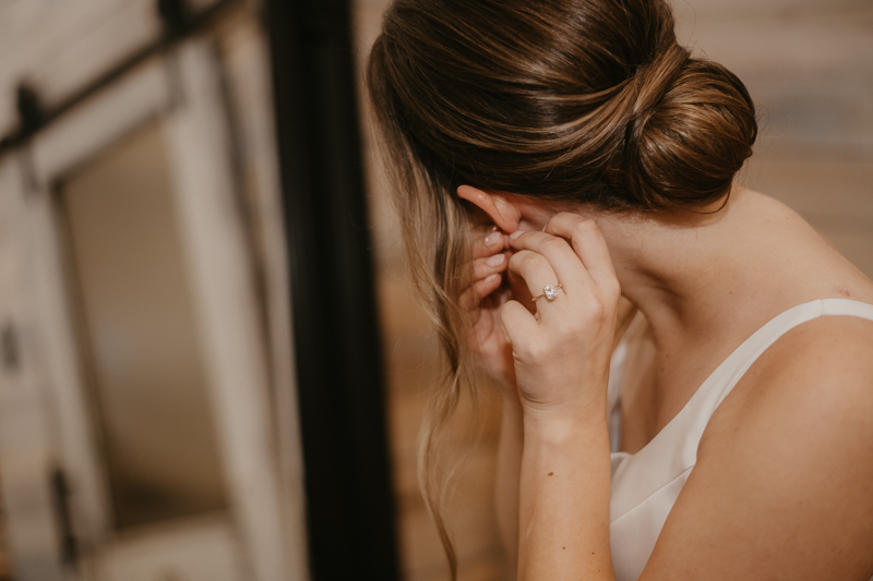 A bride getting ready for her wedding at Kylan Barn in Delmar, Maryland by Britney Clause Photography