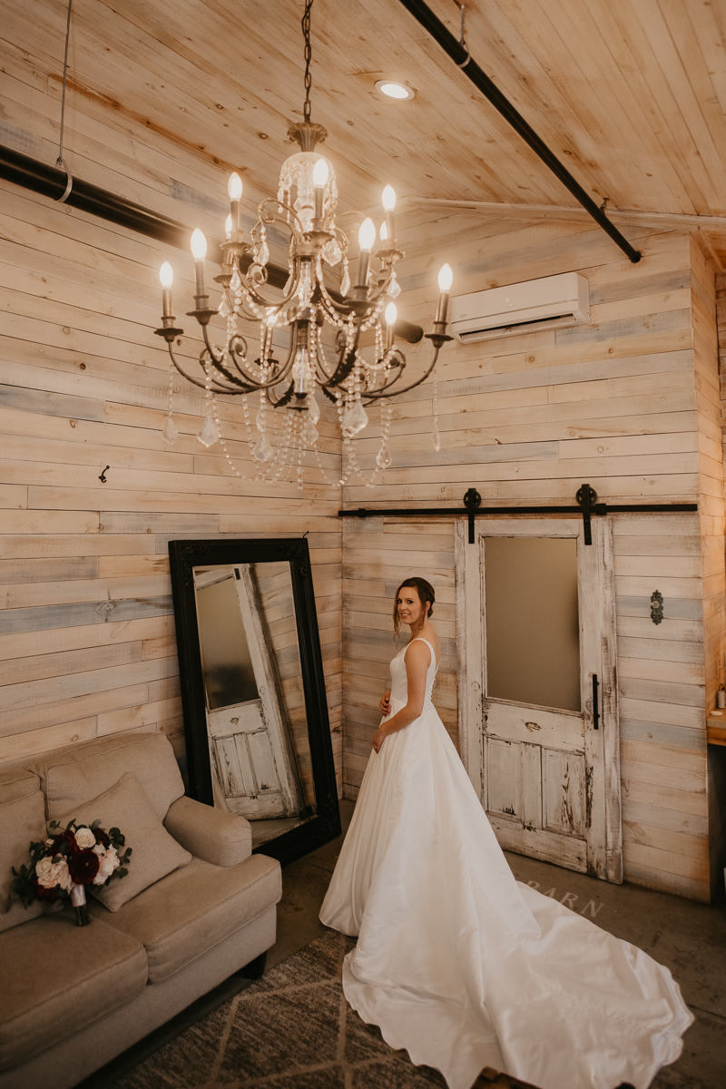 A bride getting ready for her wedding at Kylan Barn in Delmar, Maryland by Britney Clause Photography