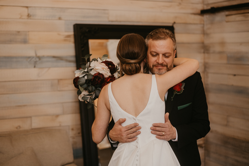 A bride getting ready for her wedding at Kylan Barn in Delmar, Maryland by Britney Clause Photography