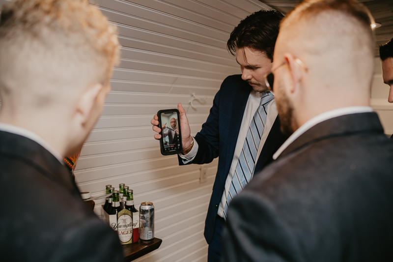 A groom getting ready for his wedding at Kylan Barn in Delmar, Maryland by Britney Clause Photography