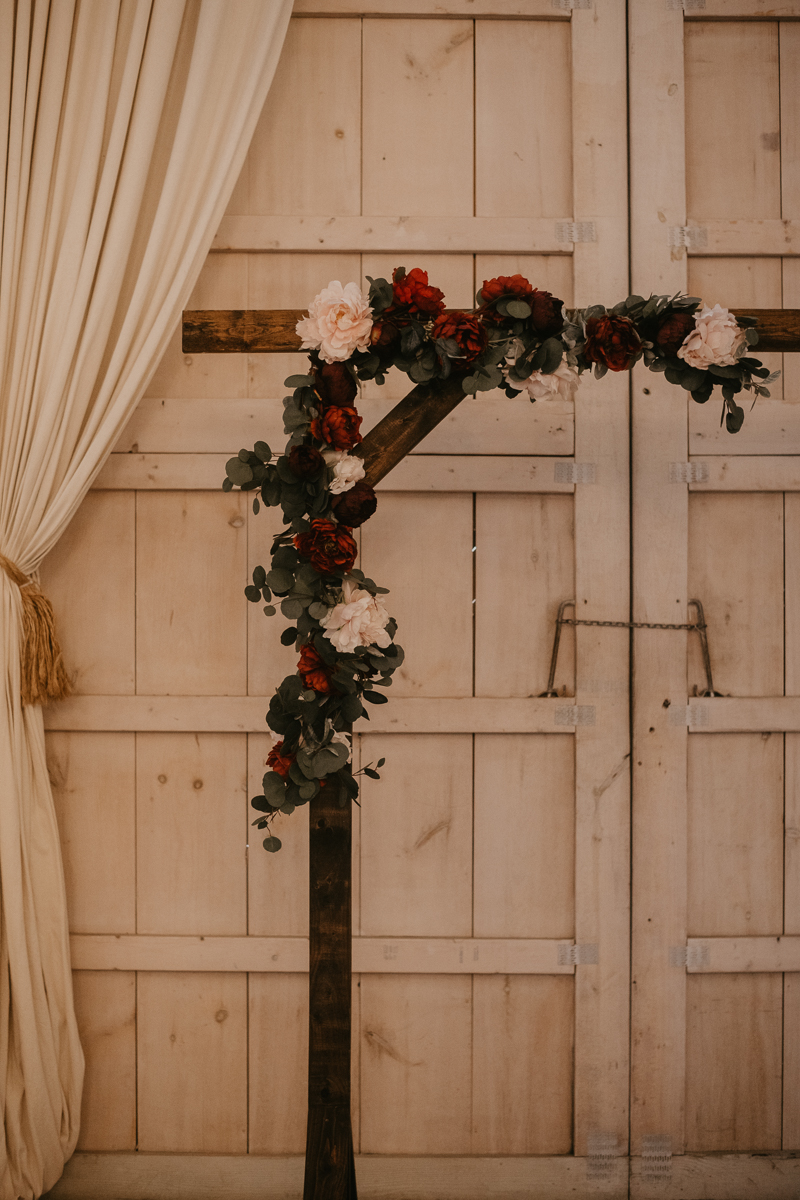 Amazing indoor wedding ceremony at Kylan Barn in Delmar, Maryland by Britney Clause Photography