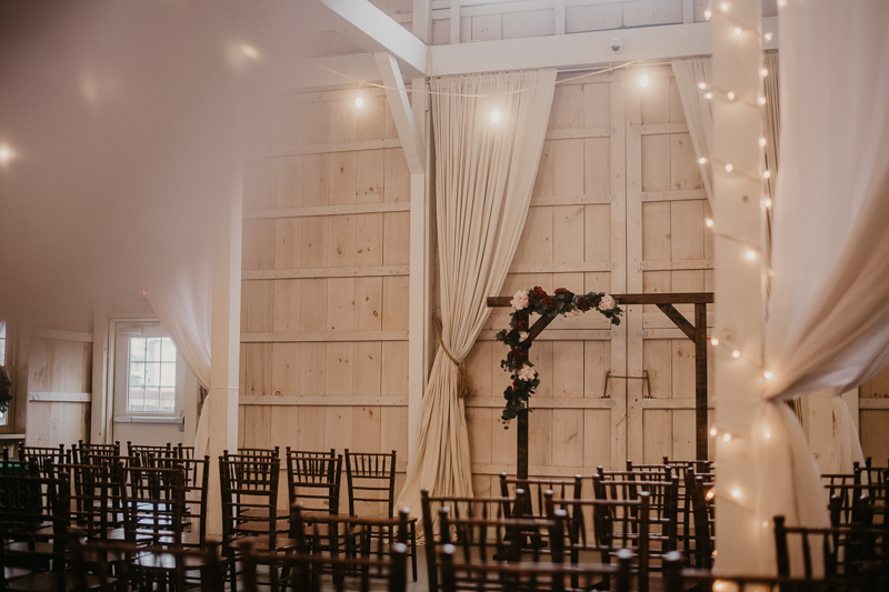 Amazing indoor wedding ceremony at Kylan Barn in Delmar, Maryland by Britney Clause Photography