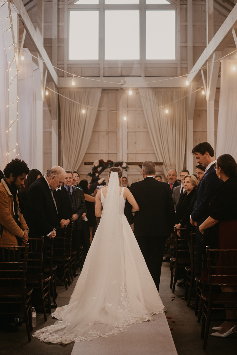 Amazing indoor wedding ceremony at Kylan Barn in Delmar, Maryland by Britney Clause Photography