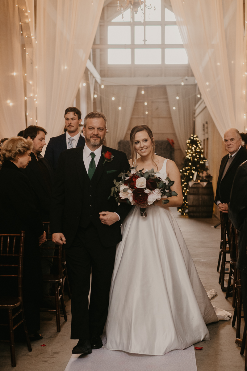 Amazing indoor wedding ceremony at Kylan Barn in Delmar, Maryland by Britney Clause Photography