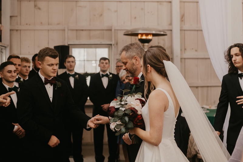 Amazing indoor wedding ceremony at Kylan Barn in Delmar, Maryland by Britney Clause Photography