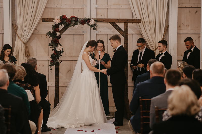 Amazing indoor wedding ceremony at Kylan Barn in Delmar, Maryland by Britney Clause Photography