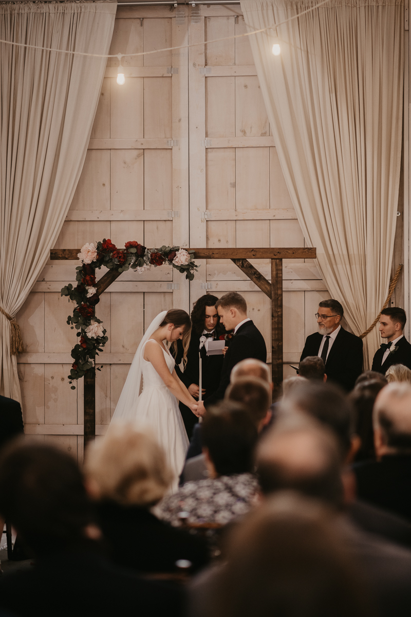 Amazing indoor wedding ceremony at Kylan Barn in Delmar, Maryland by Britney Clause Photography