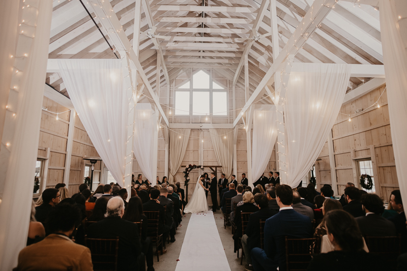 Amazing indoor wedding ceremony at Kylan Barn in Delmar, Maryland by Britney Clause Photography