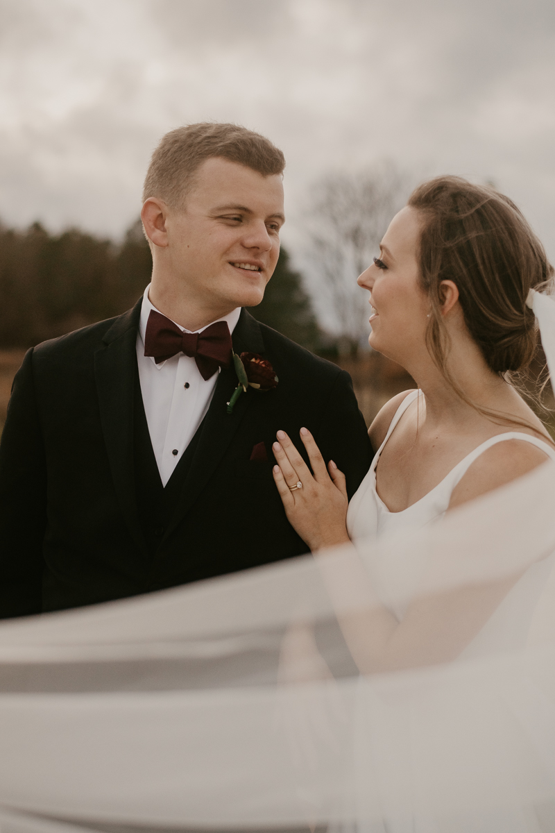 Stunning bride and groom sunset wedding portraits at Kylan Barn in Delmar, Maryland by Britney Clause Photography