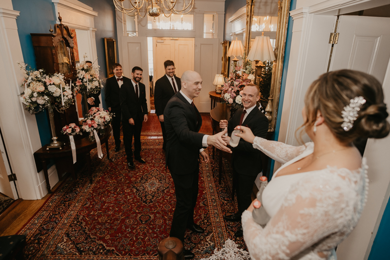 A fun first look where the bride ices the groomsmen at Antrim 1844 in Taneytown, Maryland by Britney Clause Photography