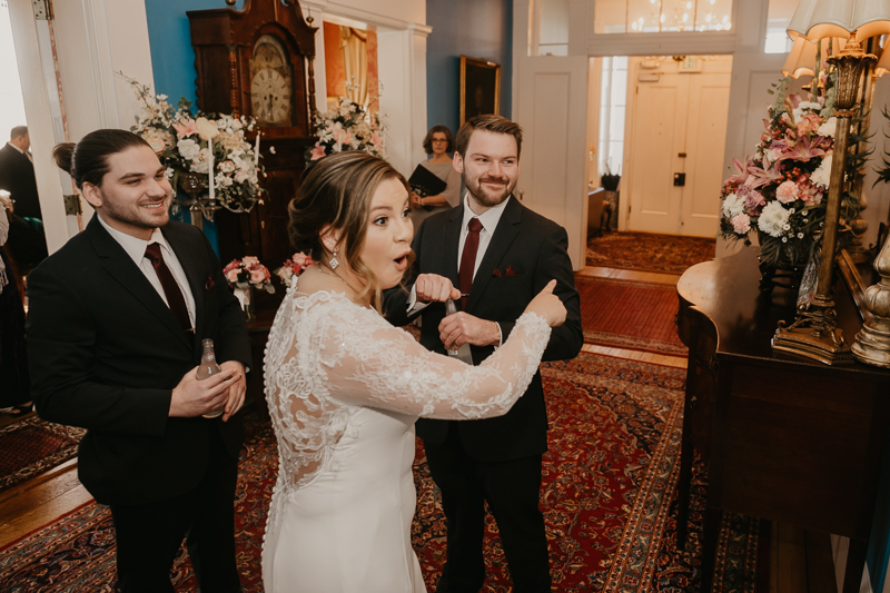 A fun first look where the bride ices the groomsmen at Antrim 1844 in Taneytown, Maryland by Britney Clause Photography