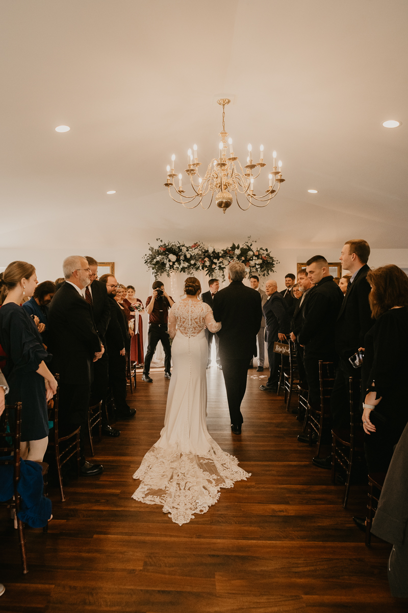 A gorgeous indoor wedding ceremony at Antrim 1844's Garden Room in the Pavilion in Taneytown, Maryland by Britney Clause Photography