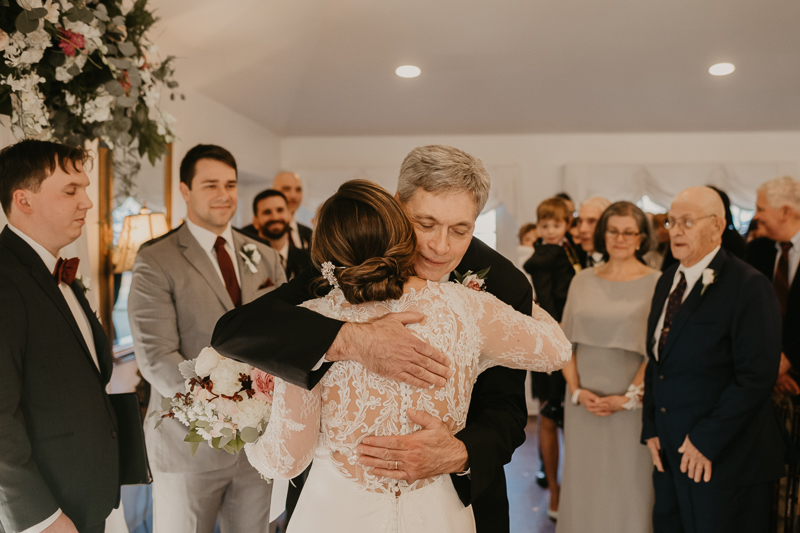 A gorgeous indoor wedding ceremony at Antrim 1844's Garden Room in the Pavilion in Taneytown, Maryland by Britney Clause Photography